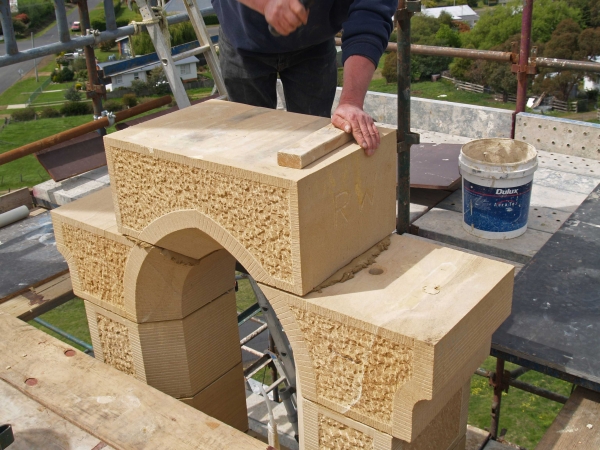 Apex stone of upper bell opening being tamped into position (Image: Brian Andrews)