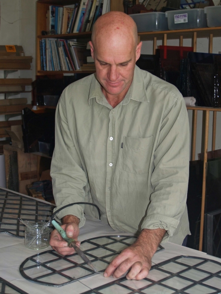 Gavin Merrington conserving a clerestory window (Image: Brian Andrews)