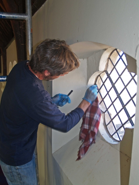 Paul Johnston completing re-installation of a clerestory window (Image: Brian Andrews)