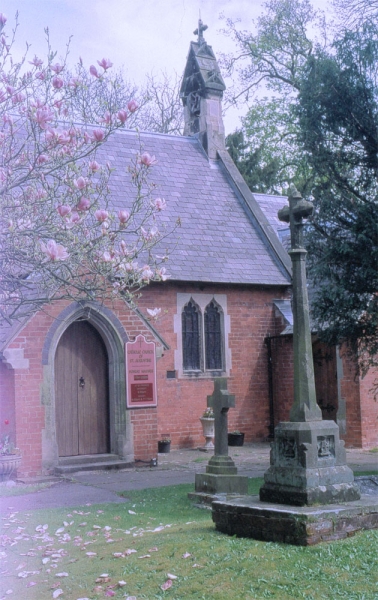 <p>porch and churchyard cross (Image: Brian Andrews)</p>
